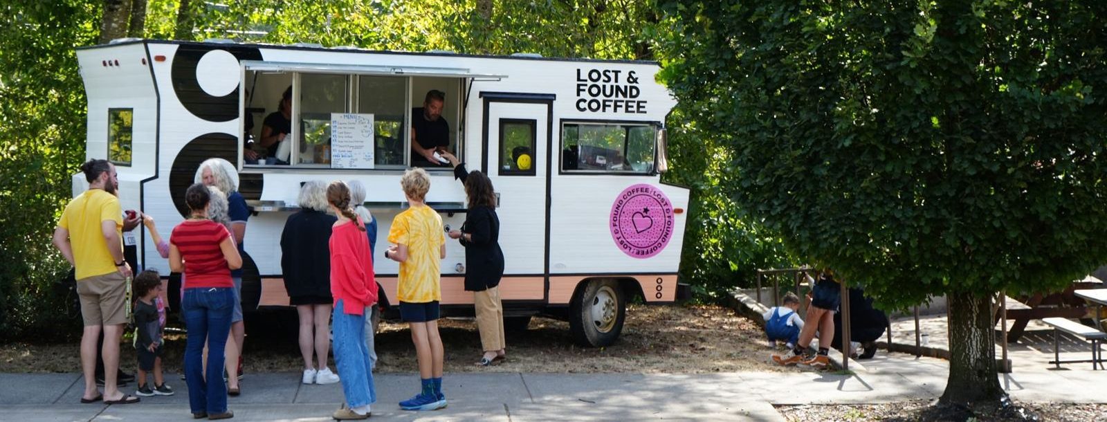 The Minnie Winnie espresso truck serving a line of customers
